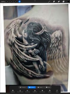 a man with an angel tattoo on his back