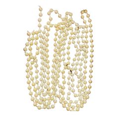 a bunch of white beads hanging from the side of a wall in front of a white background