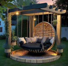 an outdoor swing bed is lit up at night