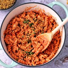 a large pot filled with pasta and sauce