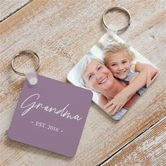 a keychain with an image of two people and the words grandma on it