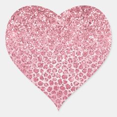 a heart shaped sticker with pink glitter and leopard print