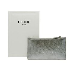 Brand: Céline Model: Color: Silver Material: Leather Inclusions: box Dimensions: 7cm x 12.5cm Serial number: U-SD-5118 Country of origin: Italie Condition: AB - good condition. Introducing the Celine Compact Zipped Card Holder 1, a sleek and stylish accessory designed for the modern woman who values both fashion and practicality. Crafted from high-quality leather in a chic silver color, this card case exudes sophistication and elegance. Perfect for organizing your cards and small essentials with Celine Wallet, Italy Design, Physical Properties, Leather Card Case, Box Dimensions, Silver Material, Stylish Accessories, Compact Design, Woman Colour