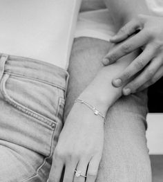 black and white photograph of a woman's hand on her lap