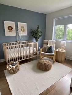 a baby's room with a crib, rocking chair and rug in it