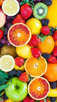 an assortment of fruits are arranged in the shape of a face on top of each other