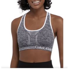 Calvin Klein Medium Impact Reversible Seamless Sports Bra Small. Product Details Fabric Type 95% Nylon, 5% Spandex Care Instructions Machine Wash Origin Imported Closure Type Pull-On Country Of Origin China About This Item Fabric Wicking Seamless 36 Workout Tops For Women, Seamless Sports Bra, Womens Calvin Klein, Workout Tops, Women's Intimates, Calvin Klein, Sports Bra, Black And Grey, China