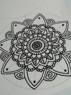 a black and white drawing of a flower with lots of details on it's petals