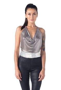 Metal halter top. Special shinny disco ball kind of metal material protected by fabric at the edges. Kayo original lotus flower metal piece at the neck for embellishment. Adjustable chain at the neck and back. Limited edition All one size Halter Neck Top For Club And Party Season, Metallic Fitted Tank Top For Party, Metallic Disco Tank Top For Night Out, Party Season Halter Neck Tank Top For Night Out, Glamorous Shiny Tank Top For Party, Fitted Halter Top For Club And Party Season, Sequin Halter Top For Party Season, Metallic Stretch Tank Top For Party, Fitted Halter Top For Club Party