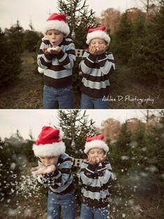 two young boys wearing santa hats standing in front of a christmas tree with snow falling on them