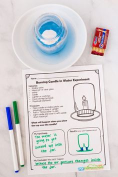 the contents of a water experiment on a table with markers, pens and an instruction book