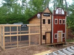 a chicken coop built into the side of a house