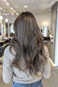 Check out these 42 chic ideas of brown hair with silver highlights that will help you embrace your first greys. From the subtle gray highlights on ash brown hair you see here to stunning silver balayage, there's a lot of gray blending inspo on our blog. Click to see it now and pin your favorite ideas! Cool Ash Brown Hair Highlights, Highlights Ash Gray, Silver Ash Brown Hair, Brown Grey Hair Color, Ash Brown Hair With Silver Highlights, Ash Grey Hair Balayage, Icy Brown Hair, Dark Ash Gray Hair, Mushroom Blonde Balayage