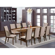 a dining room table with beige chairs around it