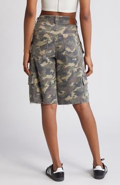 Channel laid-back skater style with these baggy denim shorts featuring camo print, a plethora of cargo pockets and raw hems for a lived-in look. 12" inseam; 12" rise Zip fly with button closure Five-pocket style; cargo flap-patch pockets 94% cotton, 5% polyester, 1% spandex Machine wash, tumble dry Imported Streetwear Short Length Cargo Jeans, Short Length Cargo Jeans For Streetwear, Utility Jean Shorts With Cargo Pockets For Streetwear, Casual High Rise Cargo Shorts With Pockets, Utility Jean Shorts For Streetwear, Utility Cargo Shorts With Multiple Pockets In Camouflage, Camouflage Relaxed Fit Utility Bottoms, Utility Camouflage Cargo Shorts With Multiple Pockets, Camouflage Shorts With Pockets For Spring