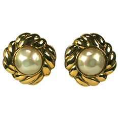 Chanel Pearl and Gilt Earrings from the 1990's. Large faux mabe pearls set into gilt rope style settings. Clip back fittings. Excellent condition. 1990's France. 1.25" diameter. Grace Bradley, Chanel Flower, Chanel Pearl, Chanel Pearls, Mabe Pearl, Faux Pearl Earrings, Chanel Earrings, Gold Pearl Earrings, Daisy Earrings