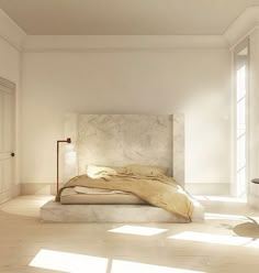 a bed sitting in the middle of a room with white walls and flooring on both sides