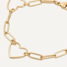 This charming piece features a series of open-heart charms connected by modern gold-plated links, creating a beautiful balance of romance and contemporary style. The delicate yet bold design makes this bracelet perfect for everyday wear or special occasions. Crafted with 18K gold-plated material, this bracelet is water-proof, tarnish-free, and hypoallergenic. The adjustable clasp ensures a secure and comfortable fit, making it an essential accessory for those who love to wear their heart on thei Trendy Gold Heart Bracelet With Adjustable Chain, Trendy Gold Heart Bracelet With Chain, Elegant Heart-shaped Bracelet With Chain, Elegant Gold-tone Bracelets For Valentine's Day, Elegant Gold-tone Bracelet For Valentine's Day, Gold Double Heart Bracelet, Trendy Gold Heart Bracelet With Heart Charm, Yellow Gold Heart Bracelet In Metal, Yellow Gold Metal Heart Bracelet