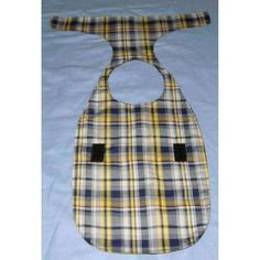 a plaid bib with a hole in the middle