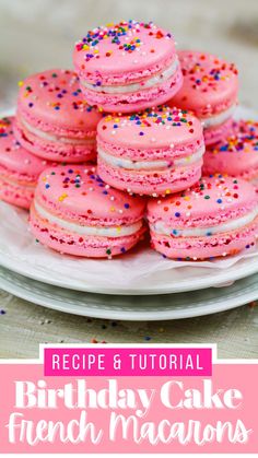 a white plate topped with pink frosted birthday cake french macarons