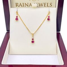 22ct Yellow Gold Drop Red Bubble Pendant & Chain With Matching Drop Earrings Metal: 22K Gold (916) Yellow Gold Total Gold Weight: 5.8gm Pendant Details: Gold Weight: 0.8gm Length x Width: 12.5mm x 4.8mm Pendant Stones: Red Cubic Zirconia Earring Details: Gold Weight: 2.4gm Length x Width: 12.5mm x 4.8mm Closure: Butterfly Chain Details: Perfect Necklace for Layering Chain Length: 16 Inches Gold Weight: 2.5gm Chain Type: Foxtail Chain (Please note that the Chain may vary) Packaging : Elegant Gift Yellow Gold Ruby Dangle Jewelry, Formal Red 22k Gold Jewelry, Hallmarked Ruby Jewelry Sets For Gift, Ruby Jewelry Sets As Gift, Red 22k Gold Round Necklace, Formal 22k Gold Red Jewelry, Butterfly Chain, Diamond Nose Stud, Gold Nose Stud