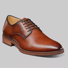 Elevate Your Everyday Look With These Florsheim Blaze Plain Toe Oxford Shoes In A Rich Cognac Color. Finely Crafted Out Of Smooth, Full Grain Leather Uppers, These Shoes Have A Go-With-Anything Style, Making Them Perfect For Wearing With Everything From Business Casual Attire To A Suite. With A D Shoe Width, They Are Designed For Men With A Uk Shoe Size Of 10.5, Us Shoe Size Of 11.5, And Eu Shoe Size Of 44.5. The Florsheim Blaze Model Is A Timeless Addition To Any Wardrobe, Suitable For Any Occa Semi-formal Cognac Leather Oxfords, Semi-formal Oxford Leather Shoes With Goodyear Welt, Brown Semi-formal Oxfords With Textured Sole, Luxury Brown Semi-formal Oxfords, Semi-formal Brown Wingtip Derby Shoes, Cognac Color, Casual Attire, Full Grain Leather, Business Casual