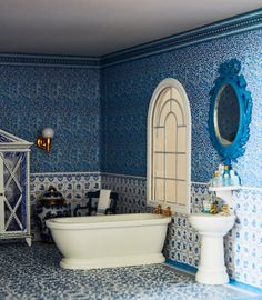 the bathroom is decorated in blue and white