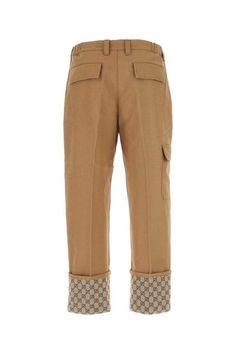 Elevate your wardrobe with these stunning beige trousers featuring a luxurious GG fabric cuff. Made from high-quality cotton, these pleated trousers exude sophistication and style. The zip and button closure, along with the cargo pockets and belt loops, make these trousers both fashionable and functional. Whether you're dressing up for a special occasion or adding a touch of elegance to your everyday look, these trousers are a must-have for anyone who appreciates premium designer fashion. Beige Beige Pleated Trousers, Fabric Cuff, Clothing Men, Pleated Trousers, Cargo Pocket, Leather Cap, Mens Gloves, Mens Fall, Denim Pant