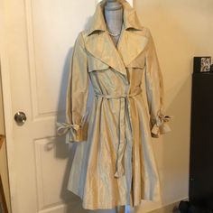 Very Sexy , Elegant Metallic Gold Coat . Never Worn , Burberry. Chic Fitted Silk Outerwear, Spring Silk Fitted Outerwear, Chic Fitted Lined Outerwear, Trench Coat Burberry, Gold Coat, Burberry Trench Coat, Burberry Jacket, Metallic Gold, Gold Metal