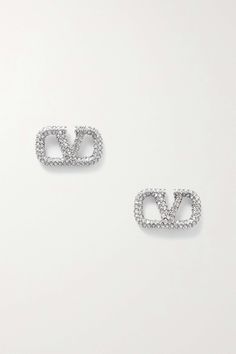 Valentino Garavani's earrings are shaped to resemble its signature 'VLOGO' emblem. They're made from polished silver-tone metal set with light-catching crystals. Designer Polished Sterling Silver Earrings, Designer Sterling Silver Earrings With Polished Finish, Designer Diamond Earrings For Anniversary, Designer Sterling Silver Earrings, Designer White Gold Earrings, Designer Silver Earrings With Polished Finish, Designer Silver Diamond Jewelry, Designer Silver Diamond Earrings, Designer Silver Earrings For Anniversary