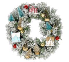 a christmas wreath with ornaments and houses on it, isolated against a white back ground