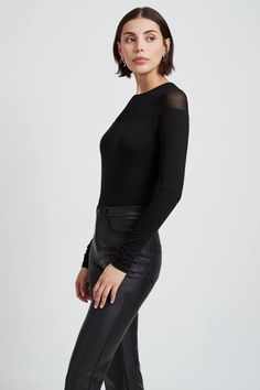 Say hello to our day-to-night gem for warmer weather, the Pearl Top. Crafted mainly from soft, high-stretch and sustainable European jersey, she's cut in a sweeping off-the-shoulder silhouette, with a neckline in sheer European jersey for that understated show of skin. Uncomplicated yet mesmerizing, Pearl is a unique long sleeve piece that's up to any styling task. We love her with faux leather jeans and glints of gold.[SPLIT] Julia, in black, is 5'10" (178 cm) tall, wearing size XS. Mariana, in Faux Leather Jeans, Pearl Top, Her Cut, Leather Jeans, The Pearl, Jersey Top, Sheer Fabrics, Maternity Fashion, Maternity Clothes