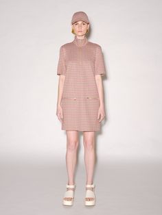 A ‘60s-style shift dress silhouette is cut in seasonal Houndstooth Check Jacquard. The slick, crisp fabric imparts perfect movement to the straight-fit dress, which is finished with polished goldtone zippers for a dimensional touch to the easy shape. An exclusive fabrication for the season, the Houndstooth Check Jacquard is similar to our Interlock Jersey with a slightly slick hand and added elastic to contour the body. It's produced by an Italian mill certified for its sustainable practices by 60s Style, Rosetta Getty, Easy Shape, High Hips, Sustainable Practices, Dress Silhouette, 60s Fashion, Fit Dress, Fitted Dress