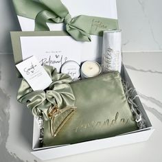 an open box containing candles and personal care items