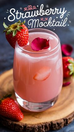 strawberry mojita cocktail in a glass with strawberries on the side