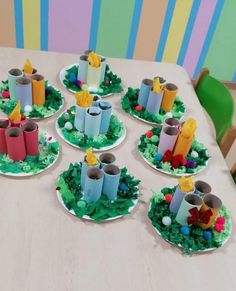 a table topped with paper plates filled with cakes