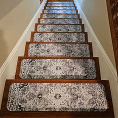 the stairs are lined with rugs and carpet