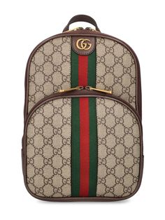 Height: 29cm Width: 20cm Depth: 5cm. Detachable adjustable strap. Single top handle. Zip closure. Front metal logo. Web detail. All over GG pattern placement may vary. Leather trim. Gold-colored metal hardware. One front zip pocket Designer Gucci Backpack With Zipper Closure, Gucci Luxury Backpack With Zipper Closure, Gucci Brown Backpack For Daily Use, Gucci Shoulder Bag With Logo Hardware For Everyday Use, Gucci Brown Standard Backpack, Gucci Classic Backpack, Gucci Bag With Zipper For Everyday Use, Gucci Bag With Zipper Closure For Everyday Use, Brown Gucci Standard Backpack