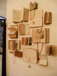 several open books are hanging on the wall