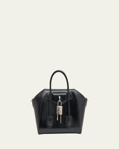 Givenchy "Antigona" satchel bag in calf leather. Rolled top handles. Detachable, adjustable shoulder strap. Envelope flap detail with hanging padlock logo charm. Feet protects bottom of bag. Made in Italy. Mini Top Handle Bag, Givenchy Antigona, Mini Top, Satchel Bag, Handle Bag, Satchel Bags, Top Handle, Givenchy, Calf Leather