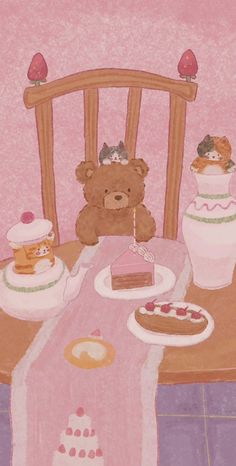 a teddy bear sitting at a table with cakes