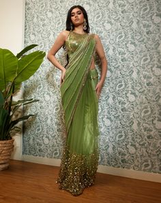 Perfect Times embodies its name, crafted from a delicate georgette base, the pre-stitched saree features net pleats, sequins, and golden beaded embroidery, which are intricately done to create a stunning texture. The saree comes with a matching halter blouse in the same shade and features delicate embroidery work, which perfectly complements the design of the saree.From Papa Don’t Preach’s Capsule collection. DELIVERY TIMEPlease allow 8-12 weeks for your outfit to arrive. FABRIC DETAILSGeorgette Papa Don't Preach, Embellished Saree, Blouse Yoke, Halter Blouse, Tulle Sleeves, Drape Saree, Embroidery Work, Dress Suits, Fesyen Wanita