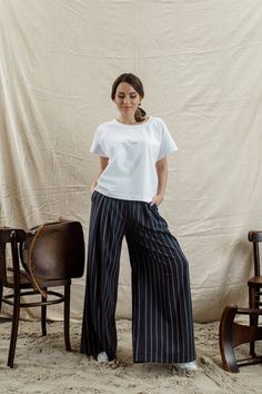 Striped high-waisted pleated palazzo pants IPANTS with back vents. They fit perfectly different body shapes and heights and visualize our unusual vision on basic pants. With this model you can create an incredibly stylish comfy everyday city look. They are perfect with almost everything, cropped t-shirt to the blouse, cardigans, flat shoes, sneakers or heels you'll find them so easy to wear. * Two side and back pockets * Zip on the middle Very high quality of tailoring and materials! Sizes avail Women Dress Pants, Pleated Palazzo Pants, Striped Palazzo Pants, Striped Wide Leg Trousers, Womens Palazzo Pants, Basic Pants, Elegant Pant, Casual Dress Pants, Wide Leg Palazzo Pants