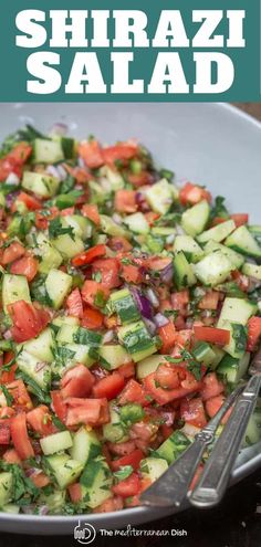 a bowl filled with cucumber and tomato salad