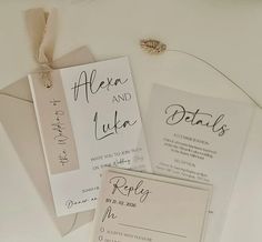 the wedding stationery is laid out on top of each other