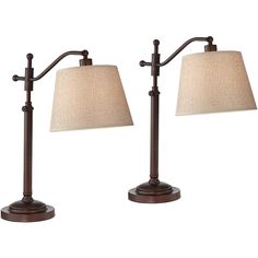 two lamps with shades on each side and one light on the other, both in bronze