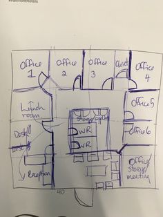 a blueprint drawing of a room with office furniture and other items on it's walls