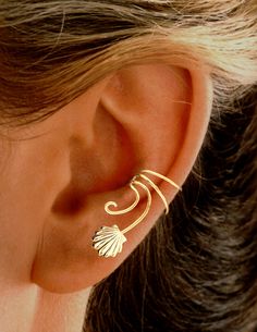 Remember Summer at the Beach? Ear Charm's Simple Sea Shell Non-pierced Curly Wave™ Ear Cuff Earring Wraps. Handcrafted, our Curly Wave Ear Cuffs are Lightweight, Comfortable, Adjustable & Affordable in Solid 925 Sterling Silver- (RAW, UN-plated) or available in Yellow Gold or White Rhodium over the sterling silver for a Shiny, Carefree finish. You can wear one on your LEFT ear OR one on your RIGHT ear as a single accent. If you order a PAIR (left and right) they are extra versatile You can w Ear Wrap Earrings, Short Wave, Ear Cuff Earrings, Unisex Earrings, Wrap Earrings, Short Waves, Gold Ear Cuff, Silver Ear Cuff, Ear Cuff Earings