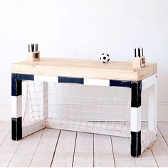 a soccer goal with two black and white sticks sticking out of it