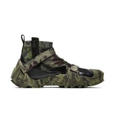 a pair of sneakers with camouflage print on them